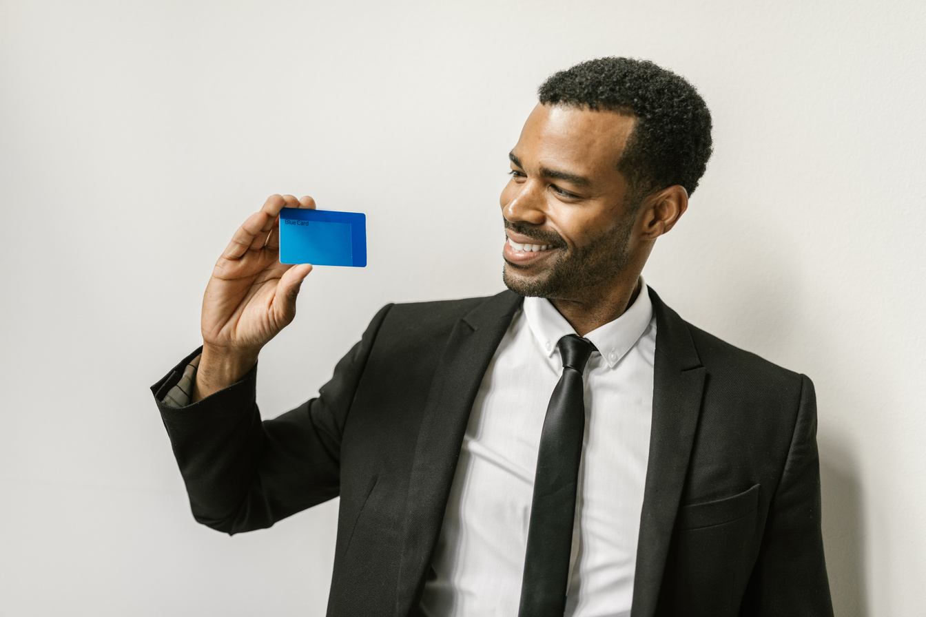 Man in Black Suit Holding Credit Card