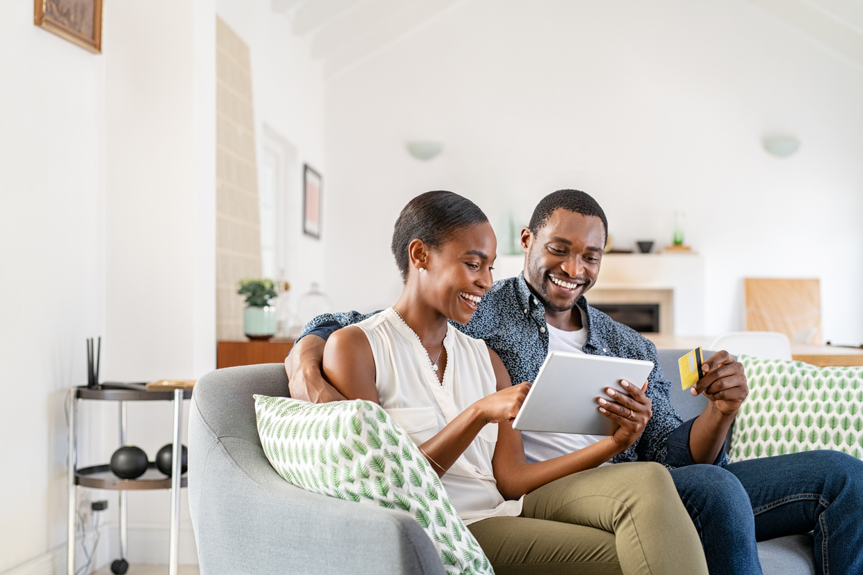 Mature Black Couple Doing Online Shopping with Credit Card Card
